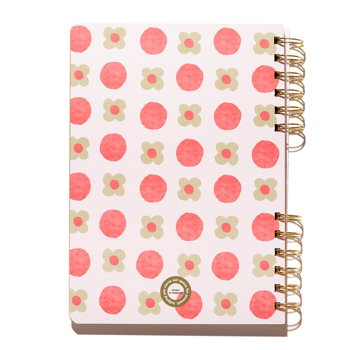Back cover of the Sage Petals spiral notebook featuring pink circles and sage green flowers with gold split-spiral binding.