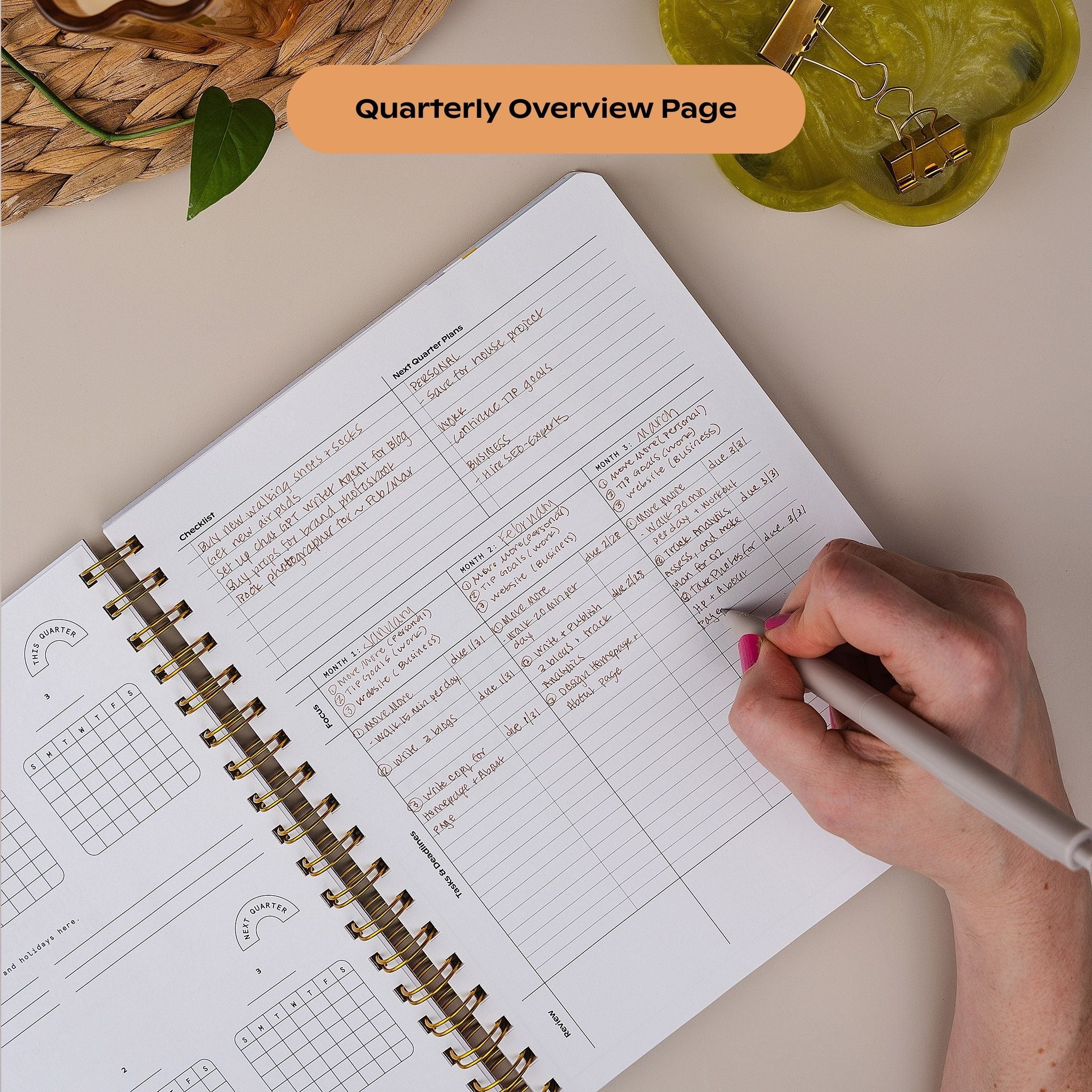 Hand writing in the Quarterly Plans daily page with time-blocking and task sections.