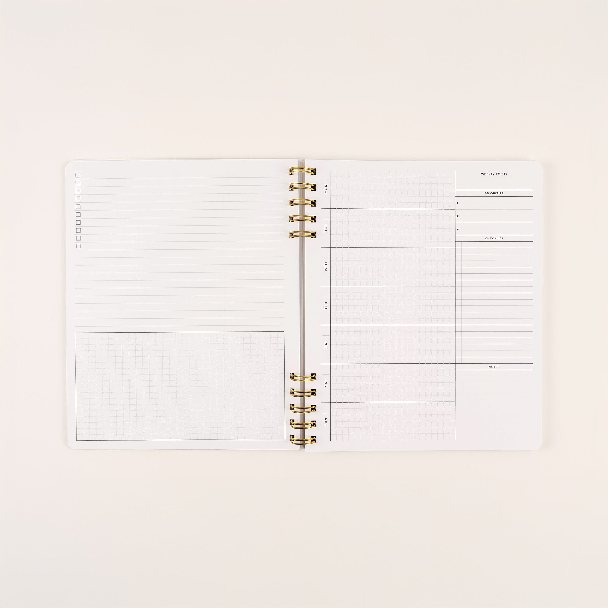 Undated quarterly daily planner with spiral binding