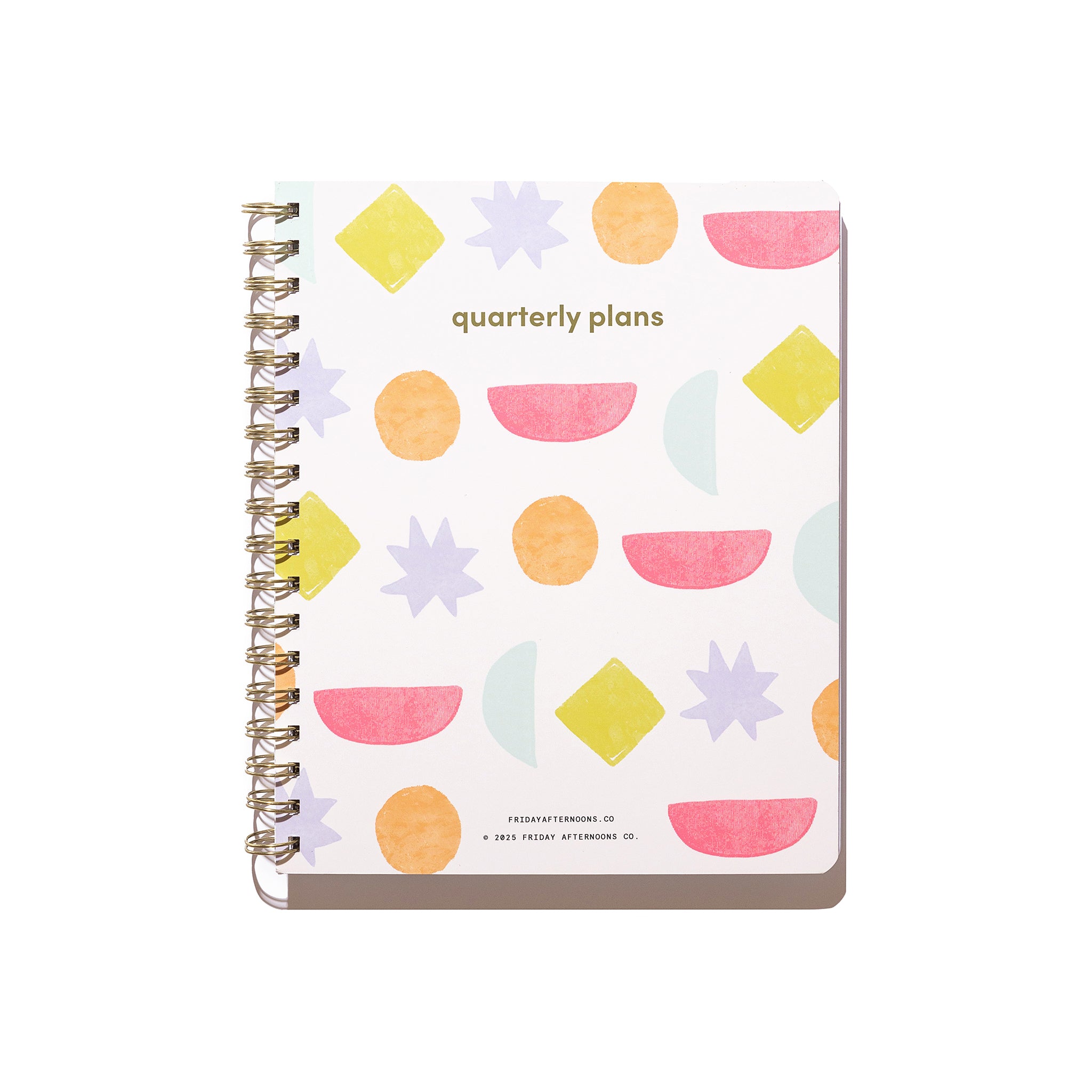 Bright Shapes Quarterly Plans 90-Day Planner front cover with gold spiral binding, geometric pattern, pink shapes, and white background