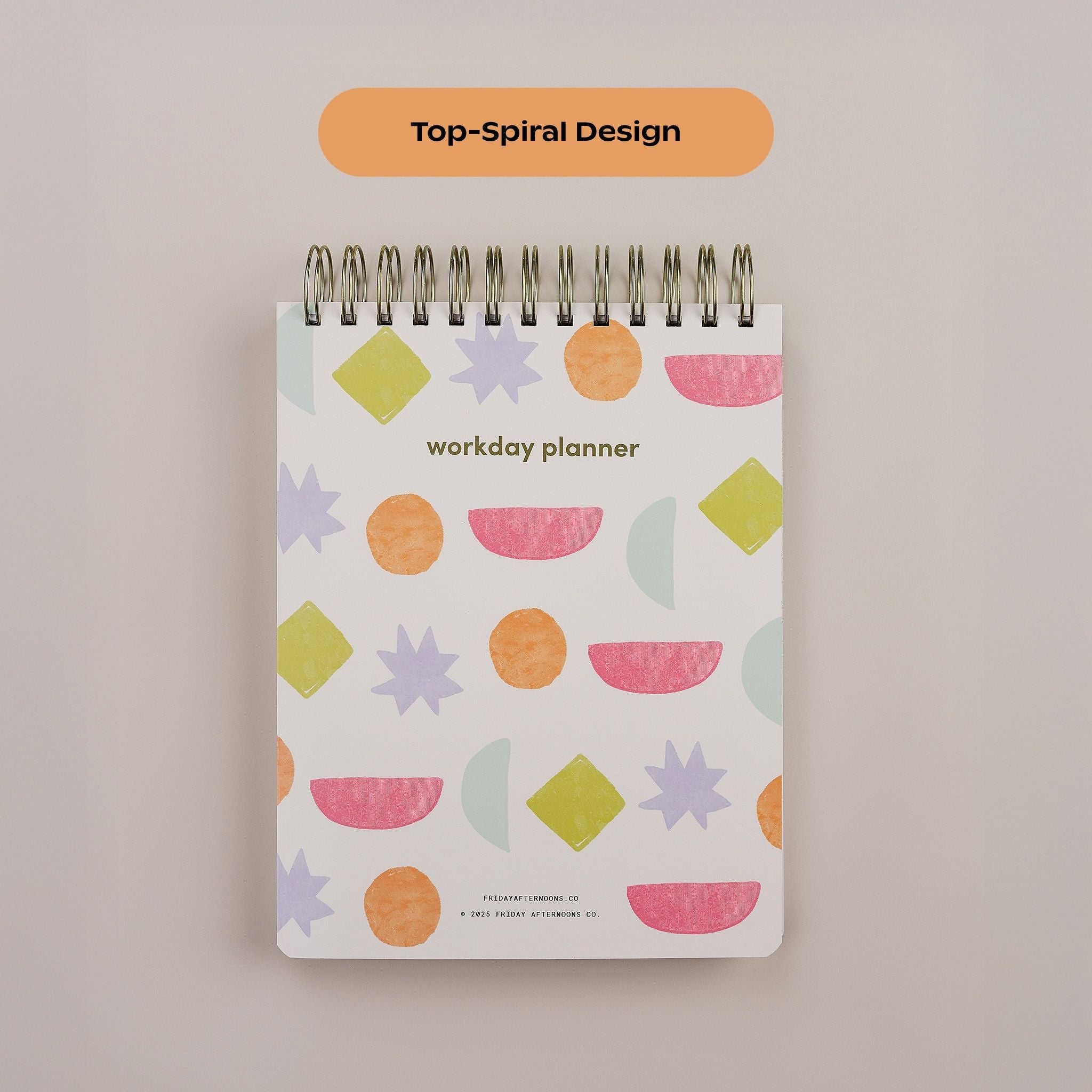 Close-up of the Workday Planner top-spiral binding and Bright Shapes patterned cover.