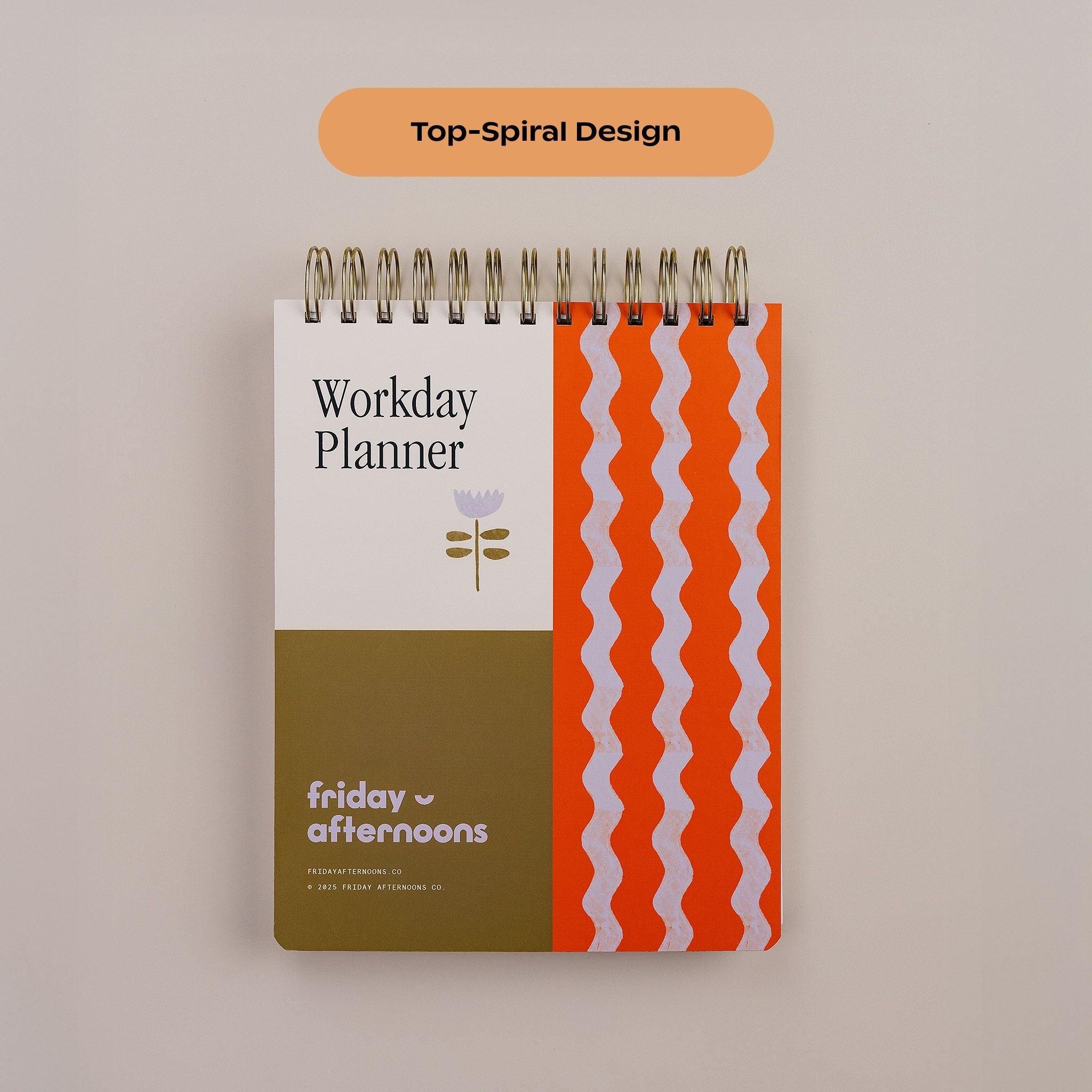 Close-up of the Workday Planner top-spiral binding and Tulip Wave patterned cover.