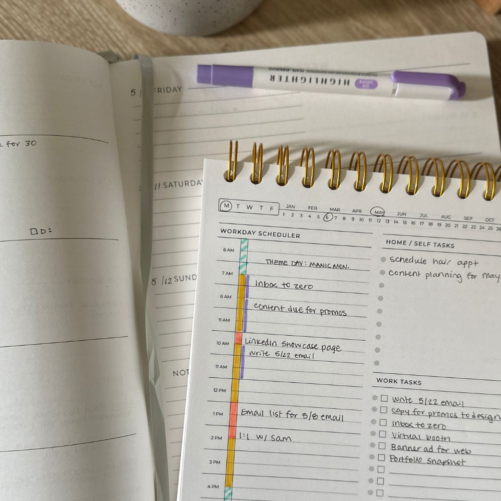 workday daily simple planner on desk with notebook and highlighter