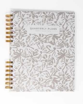 creamy painted flowers quarterly planner flat lay