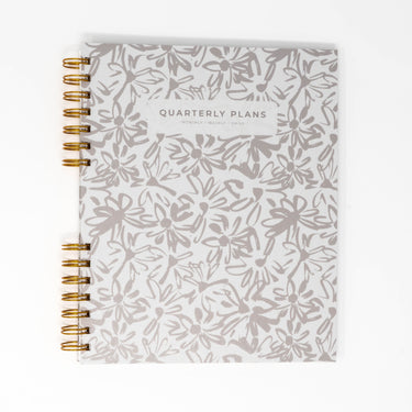 creamy painted flowers quarterly planner flat lay