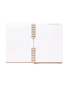 Open Daily Notes notebook showing blank lined pages, a printed date tracker, and gold split-spiral binding.