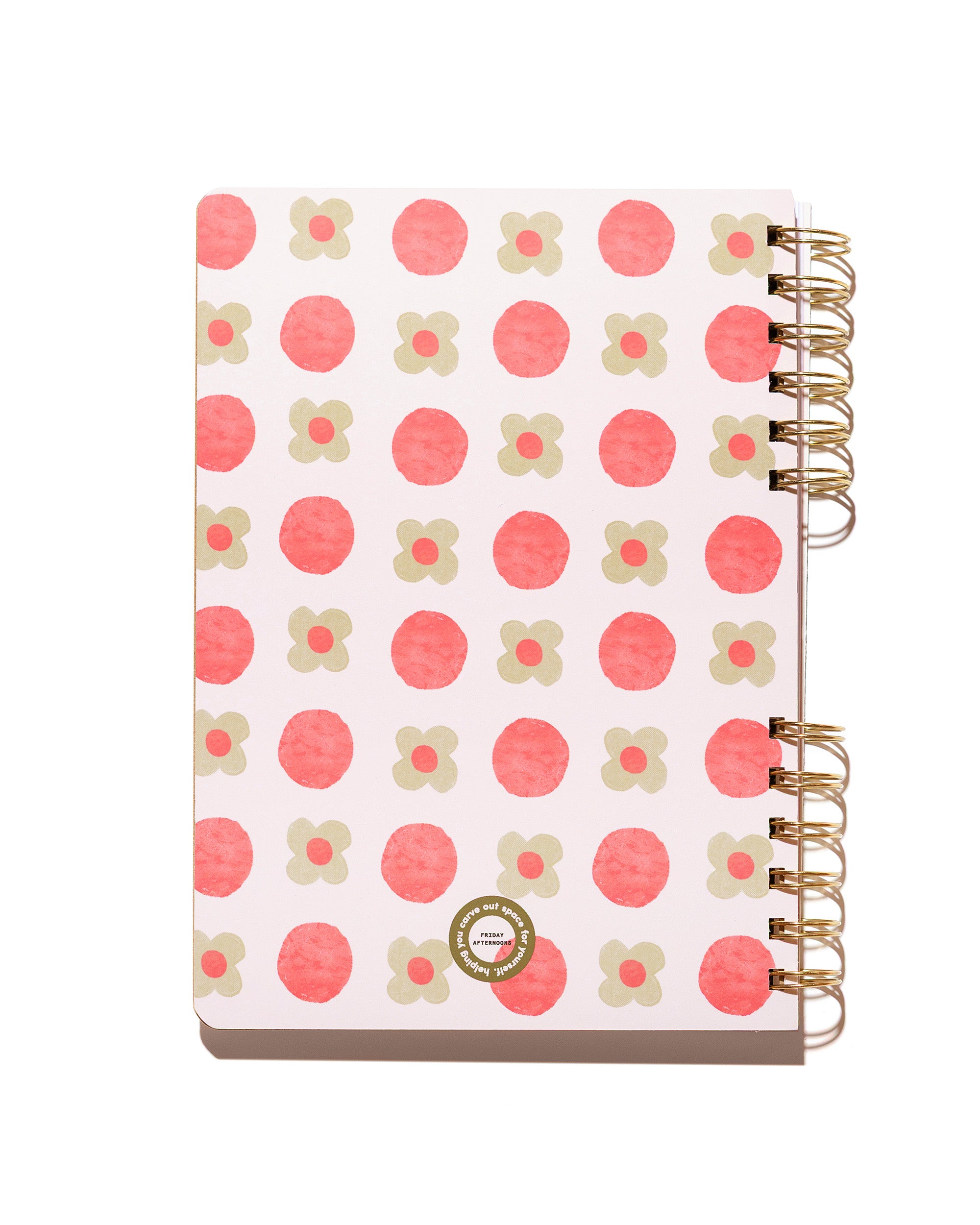 Back cover of the Sage Petals spiral notebook featuring pink circles and sage green flowers with gold split-spiral binding.