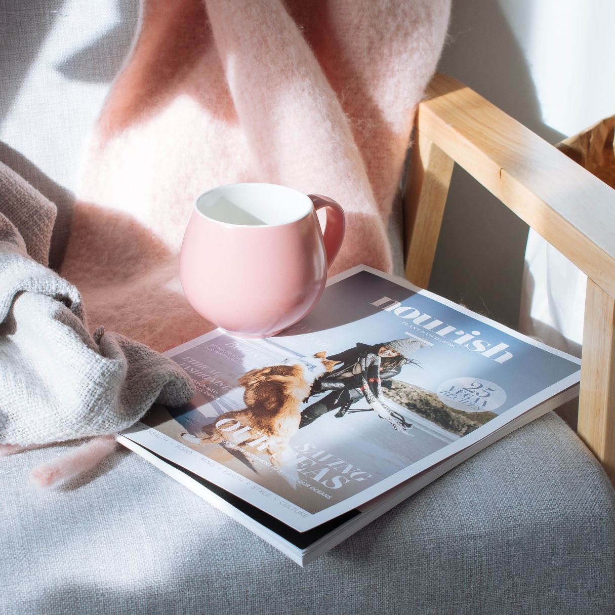 Cozy scene with coffee and nourish magazine