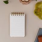 Mini Memo Notebook open to lined note pages for quick jotting and reminders.