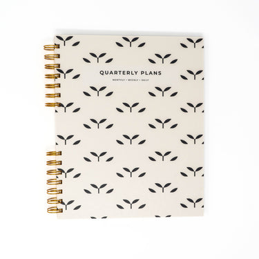 minimal geometric botanical quarterly planner flat lay