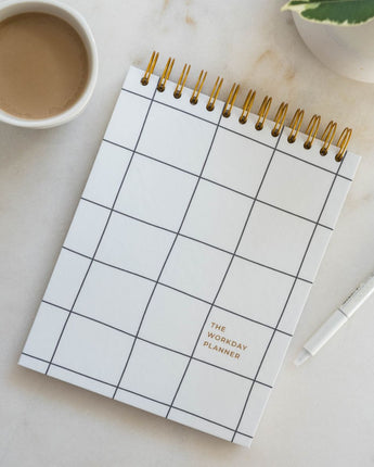 minimalist black and white workday planner tabletop