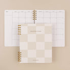 Beige checkered quarterly planner cover with monthly calendar by Friday Afternoons Co