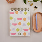 Bright Shapes Workday Planner styled with pen and office accessories on neutral desk surface.