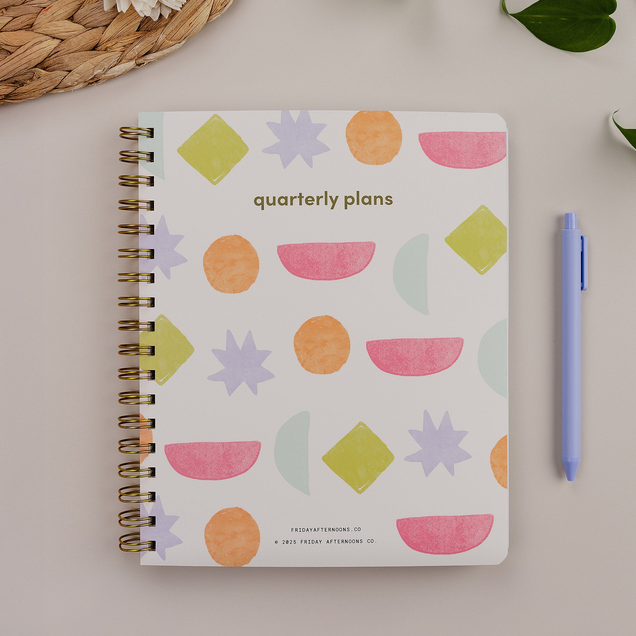 Bright Shapes 90-Day Planner styled with pen and desk accessories on a neutral background