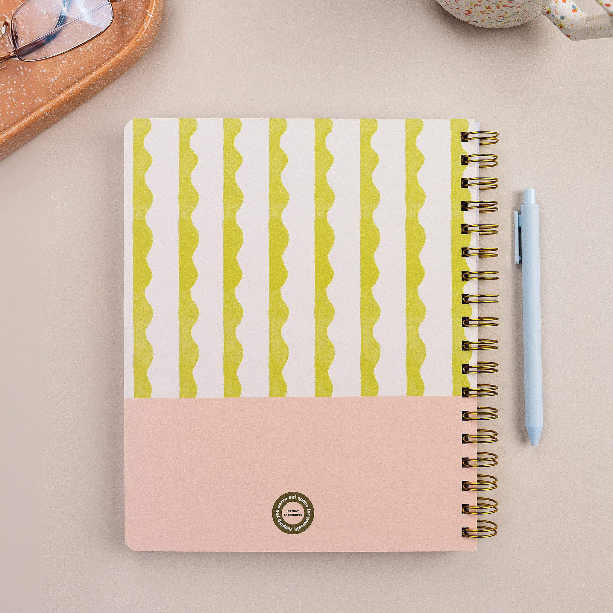 Lima Wavy Stripes Quarterly Planner styled with pen and office accessories on neutral desk surface.