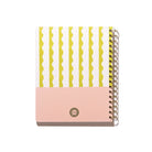 Back cover of the Lima Wavy Stripes Quarterly Plans 90-Day Planner with gold spiral binding, yellow wavy stripe pattern, pale pink panel, and white background.