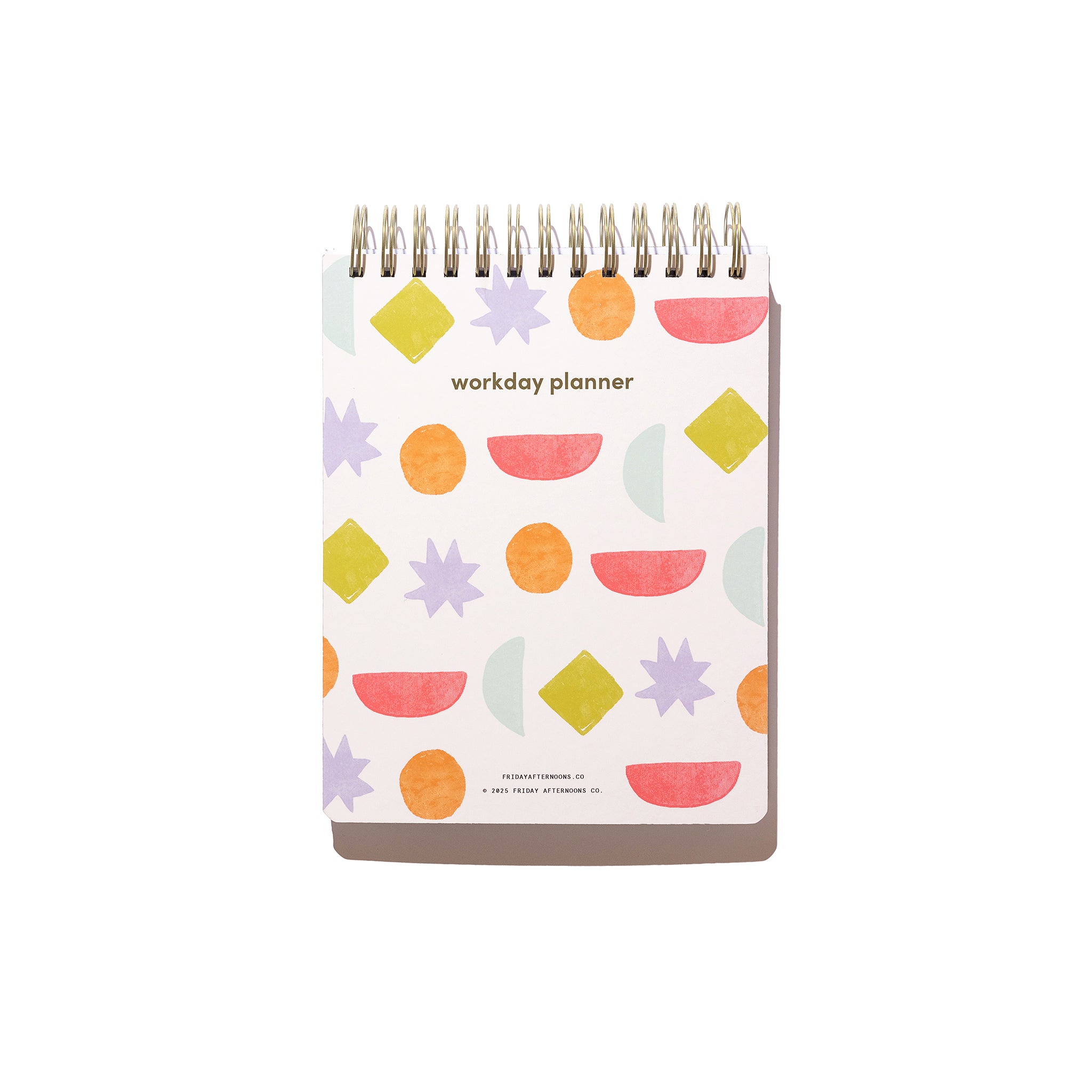 Front cover of the Bright Shapes Workday Planner with colorful geometric shapes and gold top-spiral binding.
