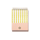 Back cover of the Lima Wavy Stripes Workday Planner with top spiral binding, yellow wavy stripe pattern, pale pink panel, and white background.
