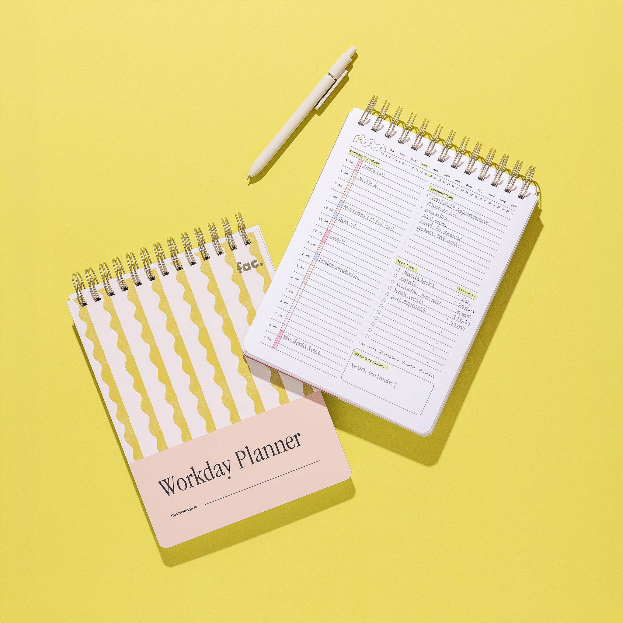 Lima Wavy Stripes Workday Planner styled on a bright yellow background, shown closed with the yellow wavy stripe cover and pale pink title panel beside an open daily planning page, with a white pen above.