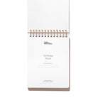 Interior title page of the Workday Planner with top-spiral binding and space to write the owner’s name.