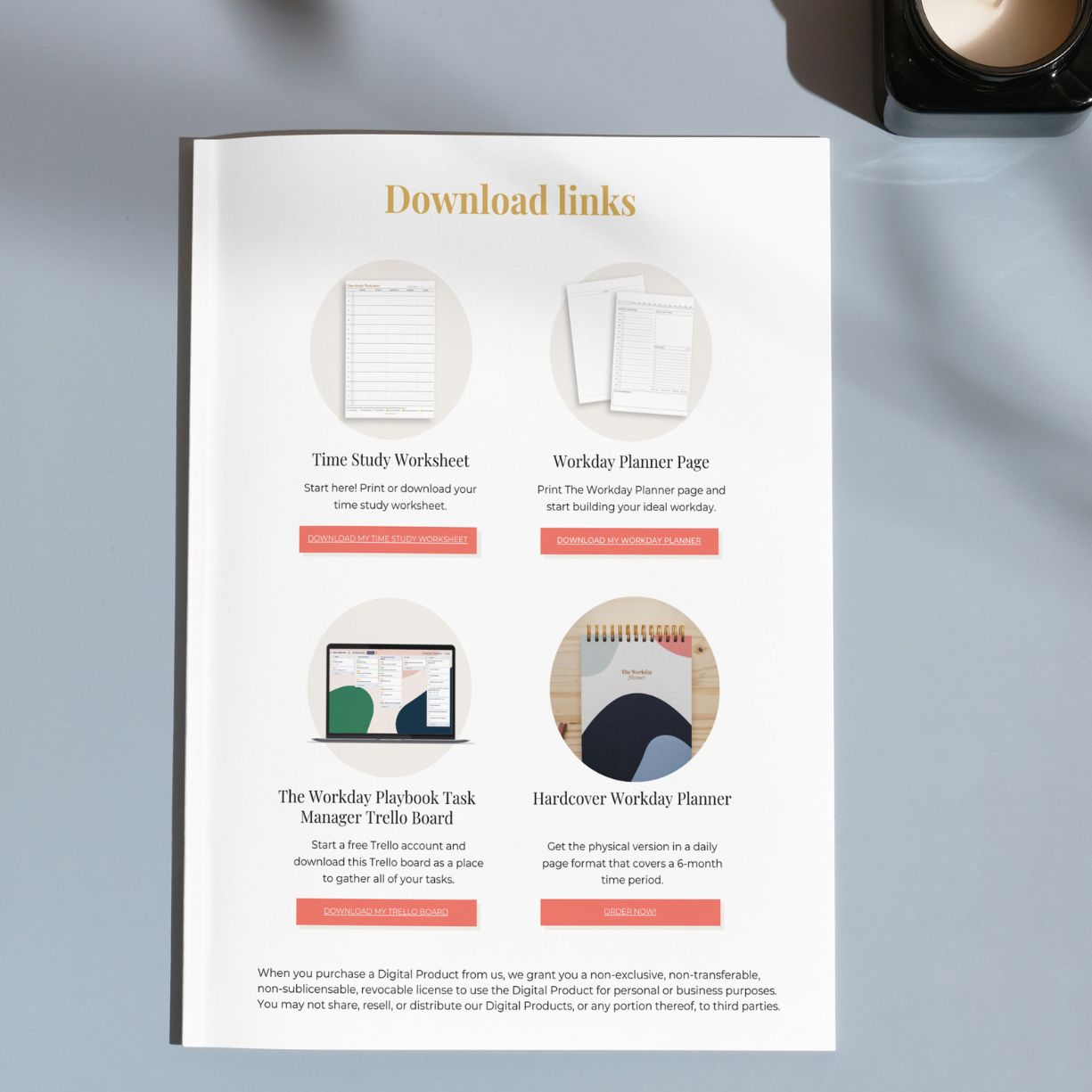 paper of bonus download links in workday set on a desk next to a candle