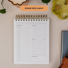 Open daily planning page of the Workday Planner showing schedule, priorities, and work and personal task lists.
